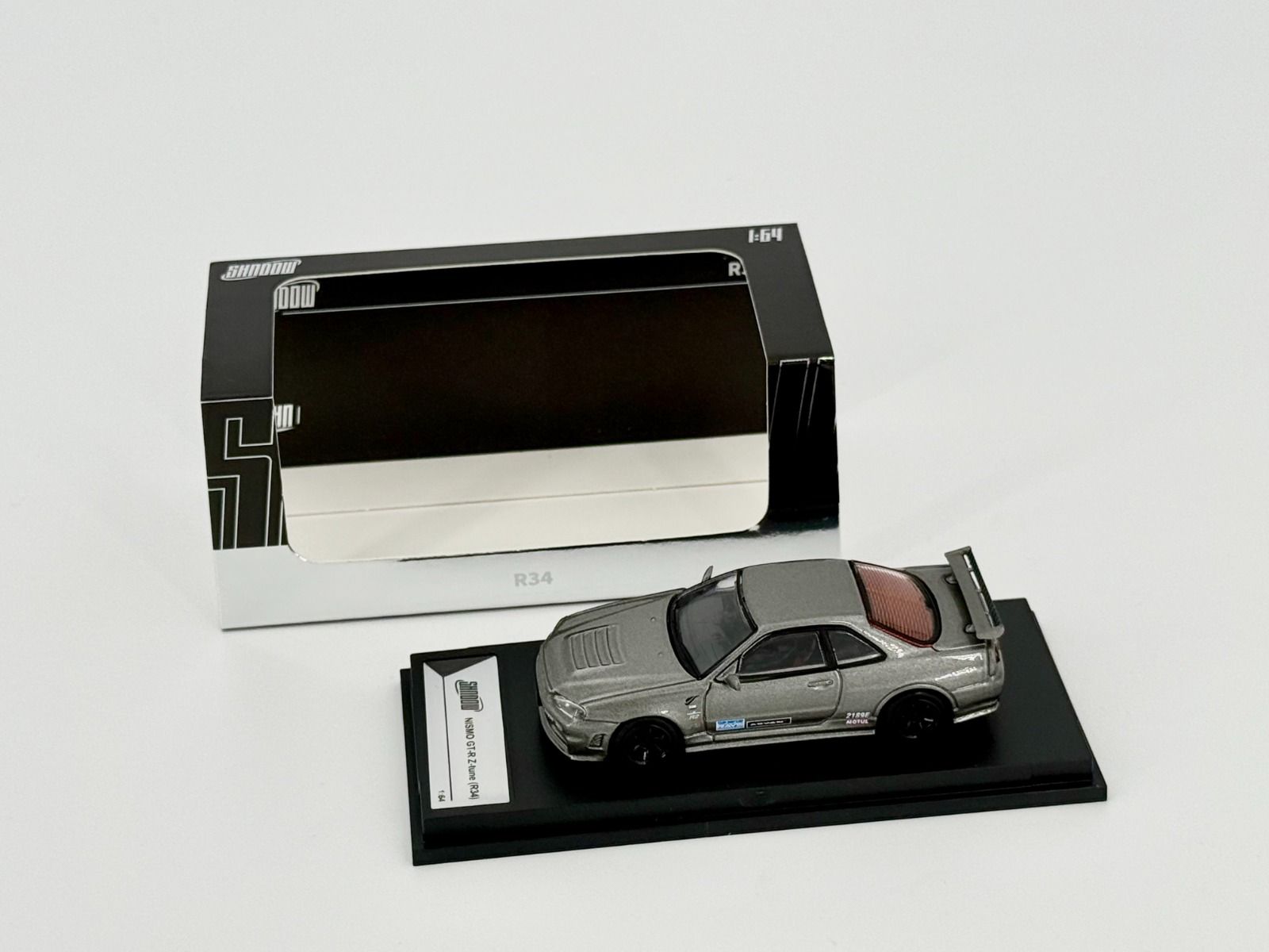 Nissan Skyline GT-R R34 Z-Tune – Grey | Shadow by GCD 1:64 Diecast
