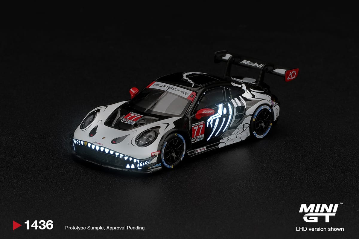 Mini GT Porsche 911 GT3 R 992 #77 AO Racing Skeleton Rexy 2026 Glow in the Dark Box 1:64 - view 1